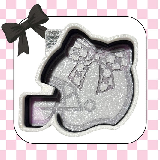 Football helmet with checkered bow