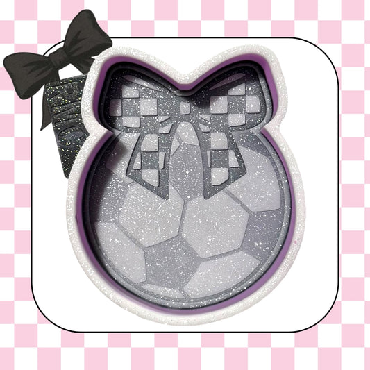 Soccer ball with checkered bow