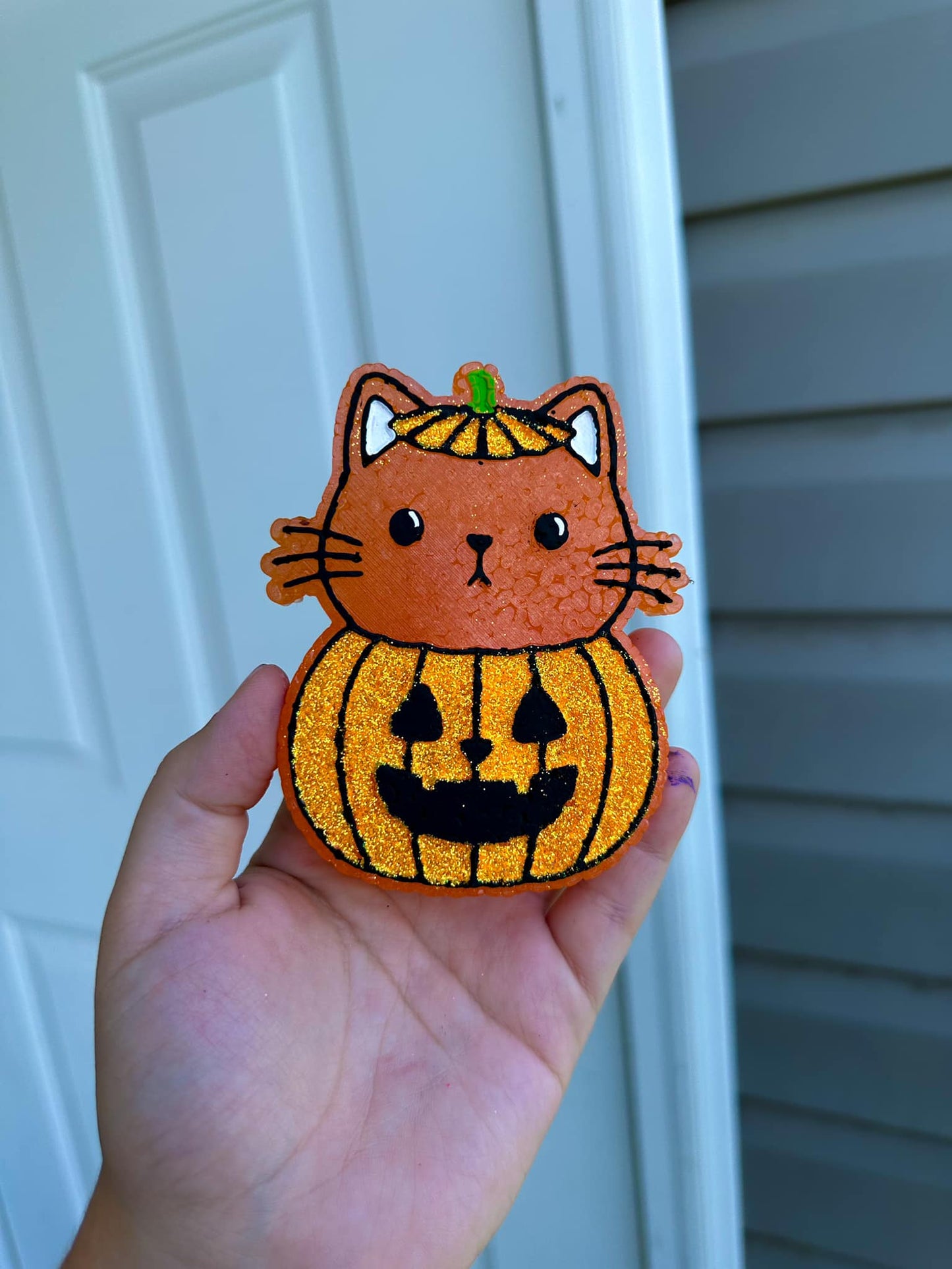 Cat in pumpkin
