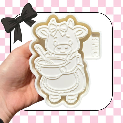 Cow with mixing bowl