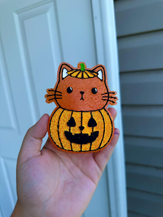 Cat in pumpkin