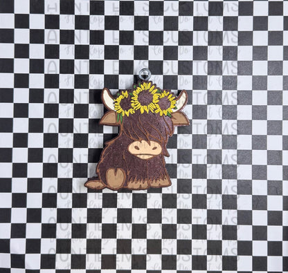 Sunflower cute highland cow
