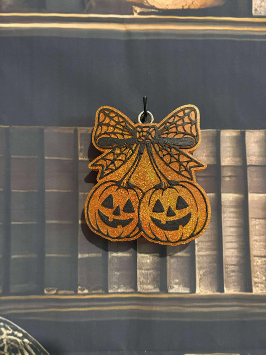 Pumpkin cherries with spider web bow