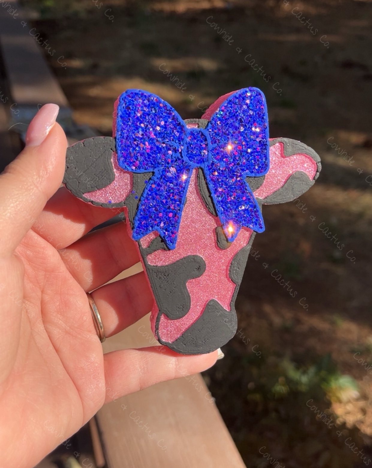 Cowprint cow head with bow