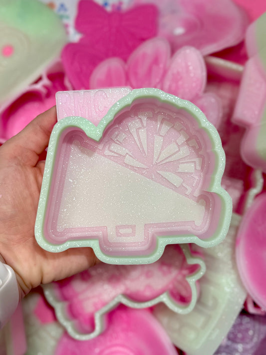 Cheerleader poms and megaphone