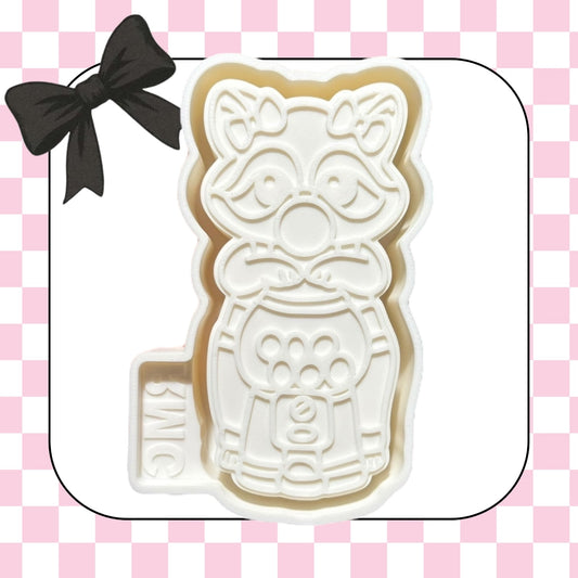 Raccoon with gumball machine