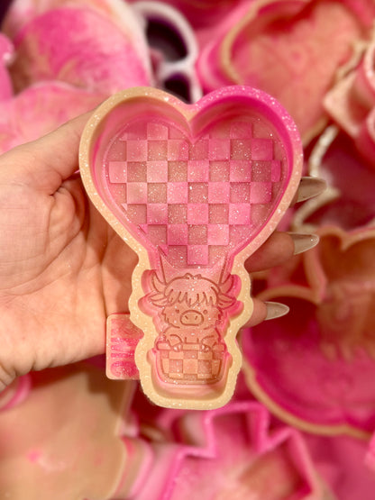 Heart hot air balloon with highland