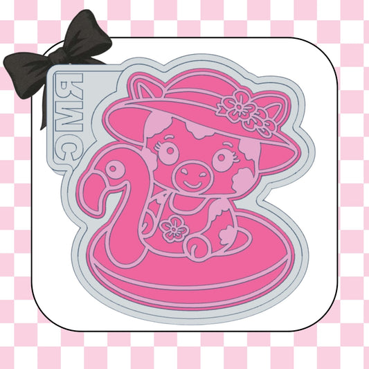 Cow with floral bikini on flamingo float