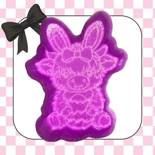 Highland cow with Easter egg