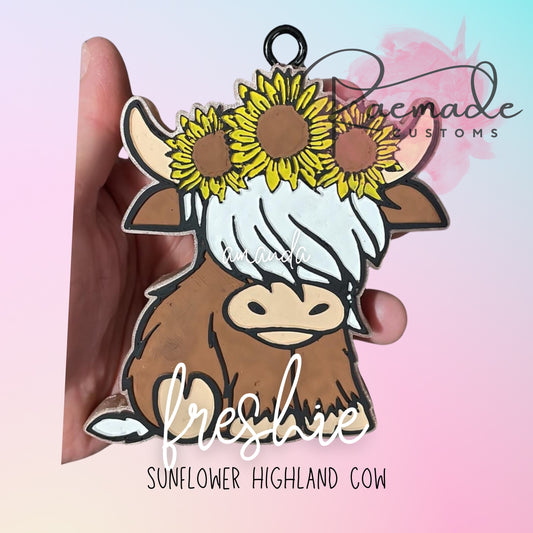 Sunflower cute highland cow