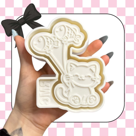 Cat with fish balloons