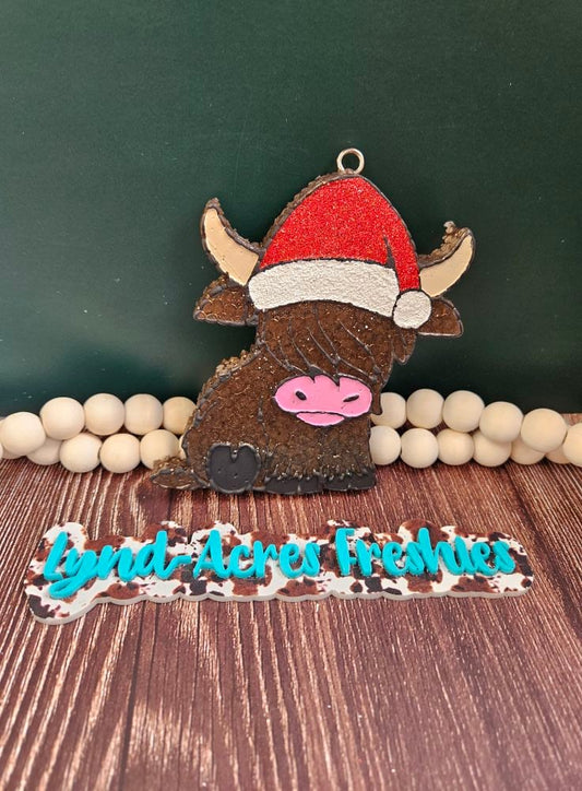 Santa hat highland cow